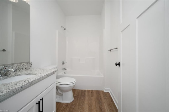 full bathroom with wood-type flooring, vanity, toilet, and shower / bathing tub combination