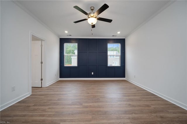 unfurnished room with ornamental molding, hardwood / wood-style flooring, and ceiling fan