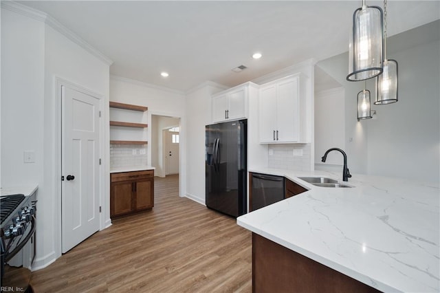 kitchen featuring black appliances, white cabinetry, decorative backsplash, sink, and light hardwood / wood-style flooring