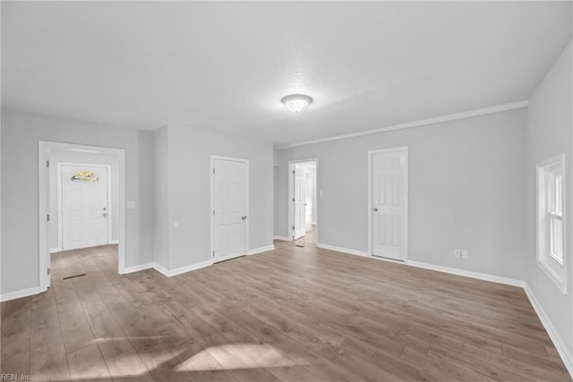 empty room with wood-type flooring