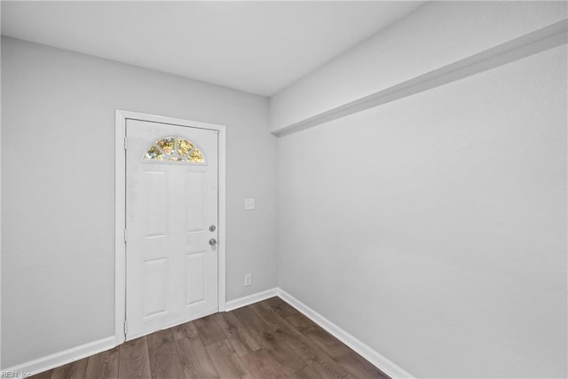 entrance foyer with dark hardwood / wood-style floors