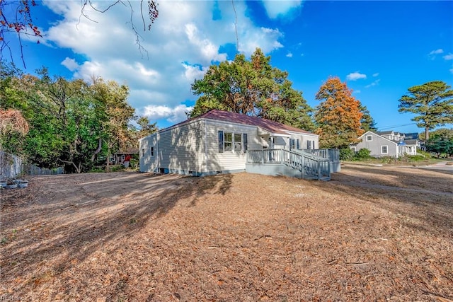 view of front of home with a wooden deck