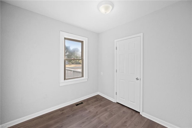 empty room featuring dark hardwood / wood-style floors