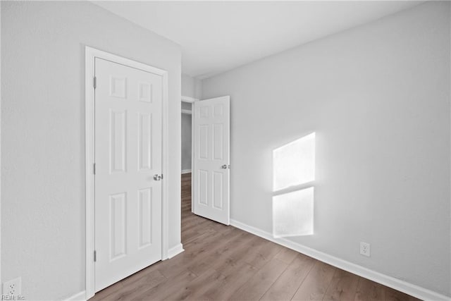 unfurnished bedroom featuring light wood-type flooring