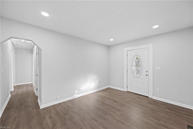 entryway with dark hardwood / wood-style floors