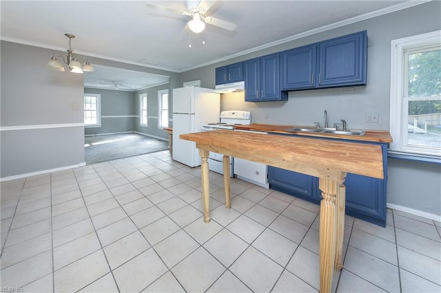 kitchen with ornamental molding, blue cabinetry, butcher block countertops, pendant lighting, and white appliances