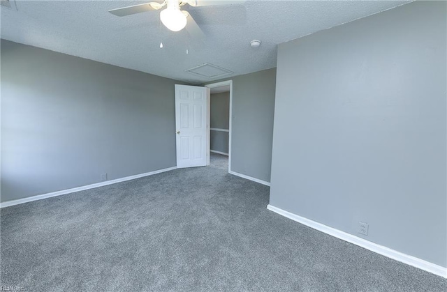 carpeted spare room with a textured ceiling and ceiling fan