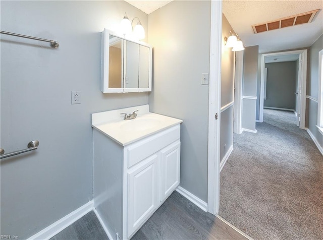 bathroom featuring vanity and hardwood / wood-style flooring