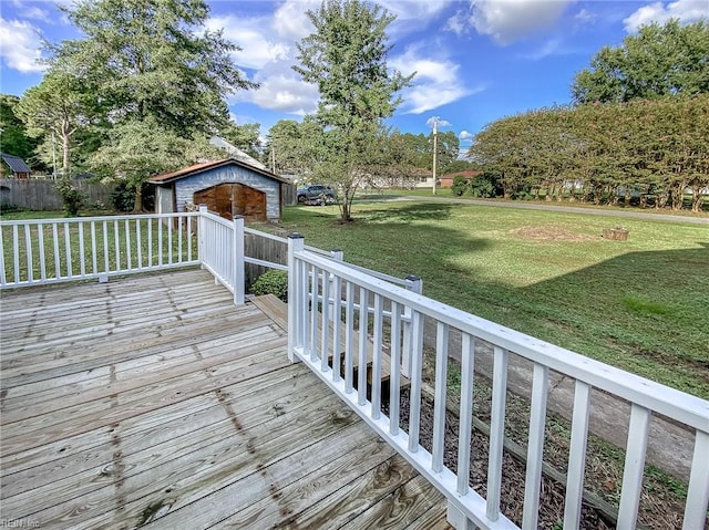 wooden terrace featuring a lawn