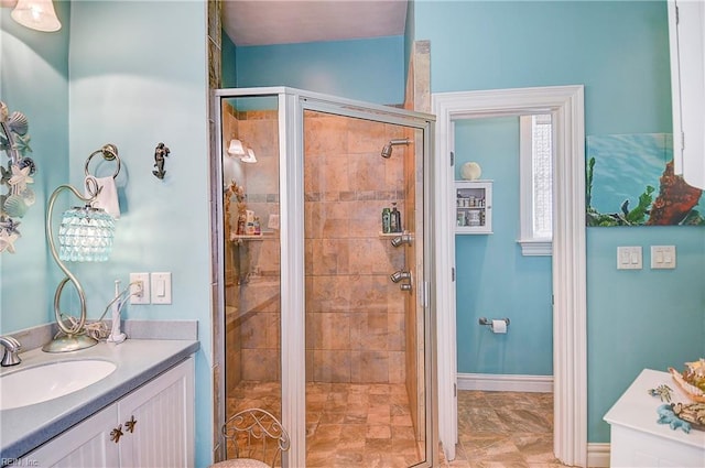 bathroom featuring an enclosed shower and vanity