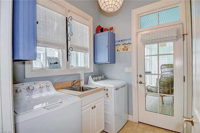 laundry room with cabinets, separate washer and dryer, a healthy amount of sunlight, and sink