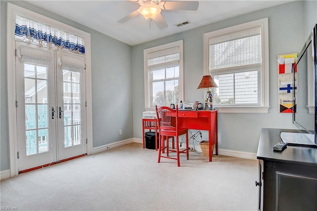 office area featuring ceiling fan, light carpet, and french doors