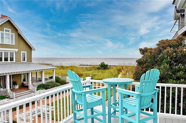 wooden terrace with a water view