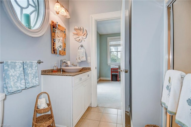 bathroom featuring tile patterned flooring and vanity