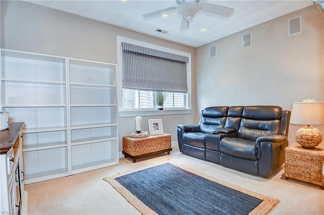 living room featuring ceiling fan and carpet floors