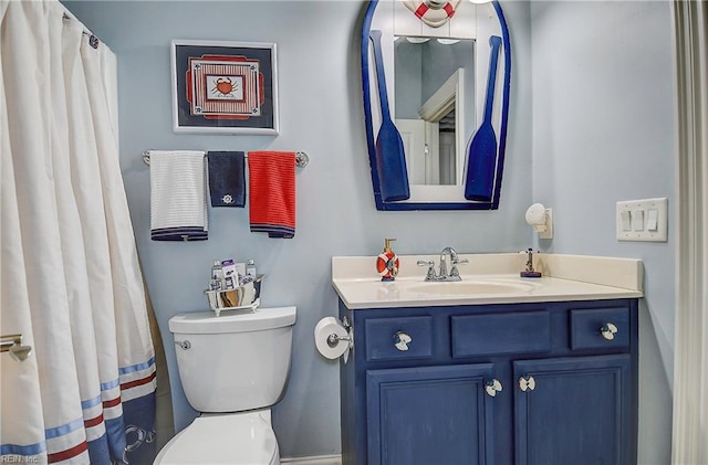 bathroom featuring vanity and toilet