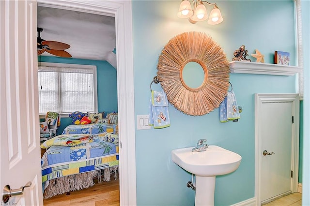 bathroom with lofted ceiling, hardwood / wood-style flooring, and ceiling fan