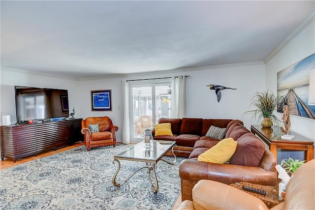 living room featuring hardwood / wood-style flooring and crown molding