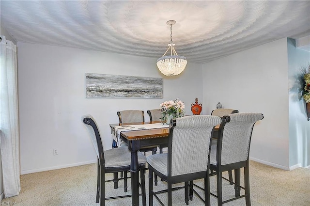 dining area featuring a notable chandelier