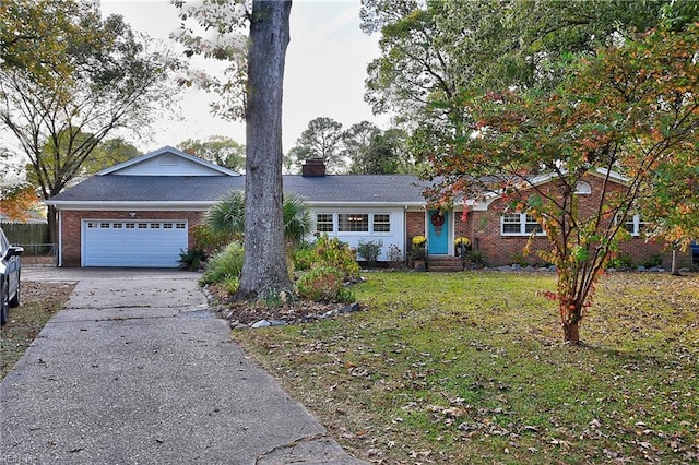 single story home with a garage and a front lawn