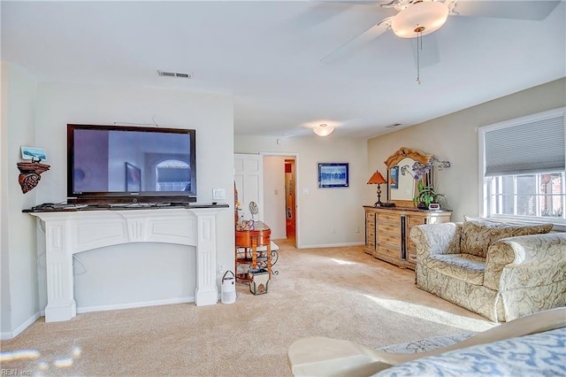 living room featuring light colored carpet and ceiling fan