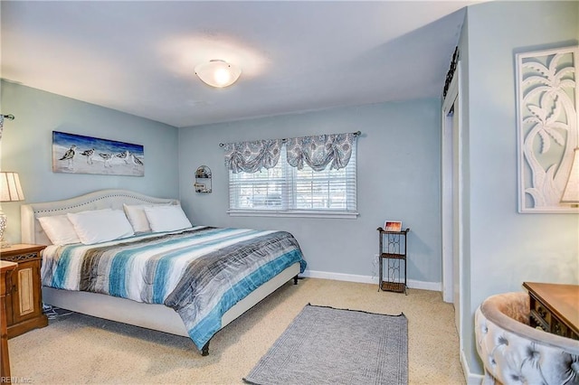 bedroom featuring light colored carpet