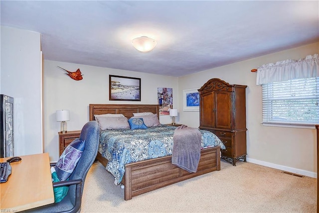 bedroom with light colored carpet