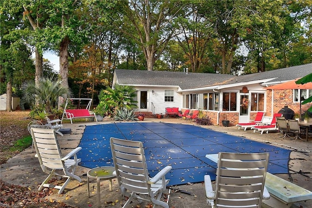 view of swimming pool featuring a patio