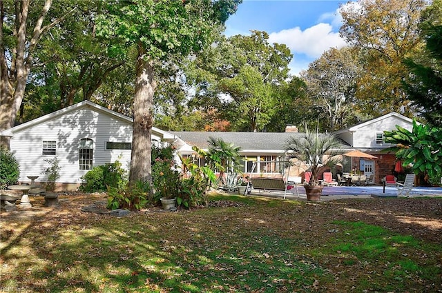 ranch-style house with a patio