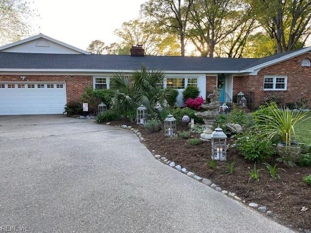 single story home featuring a garage