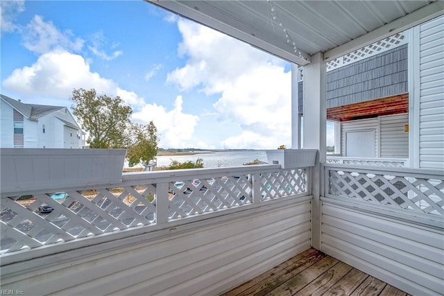 balcony featuring a water view