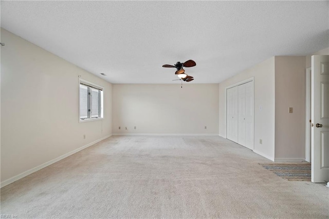157 Atlantic Ave Unit B2, Hampton, VA 23664 - spare room with a ceiling fan, light colored carpet, a textured ceiling, and baseboards