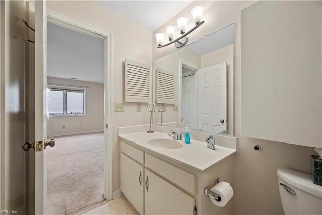157 Atlantic Ave Unit B2, Hampton, VA 23664 - bathroom with toilet, vanity, and baseboards