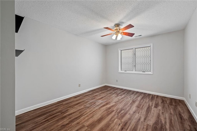 157 Atlantic Ave Unit B2, Hampton, VA 23664 - spare room with dark wood finished floors, a textured ceiling, a ceiling fan, and baseboards