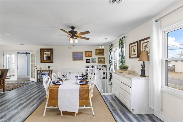 dining space featuring dark hardwood / wood-style floors and ceiling fan