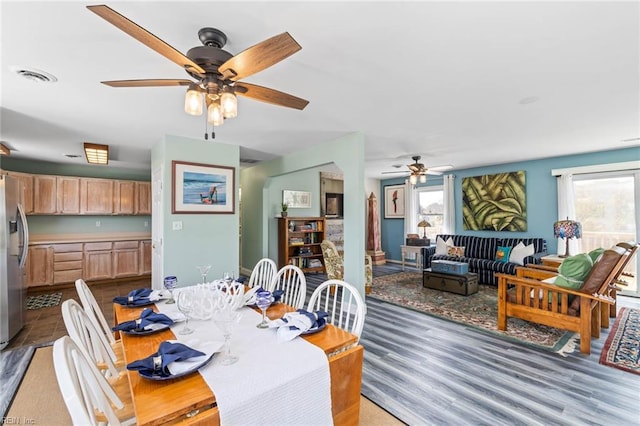 dining space featuring hardwood / wood-style floors and ceiling fan