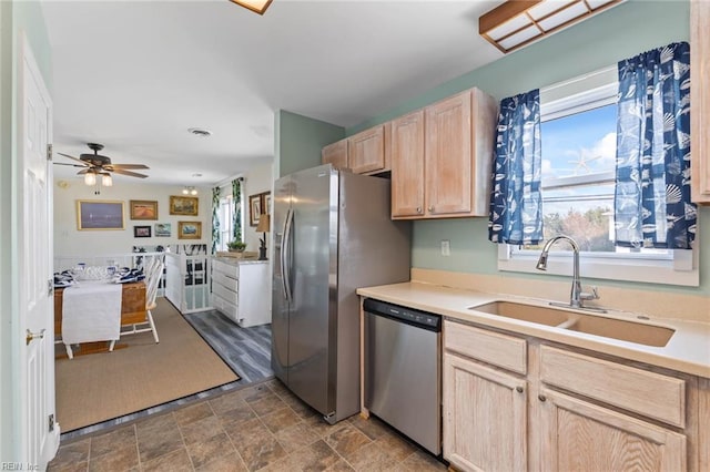 kitchen featuring light brown cabinets, sink, ceiling fan, and stainless steel appliances