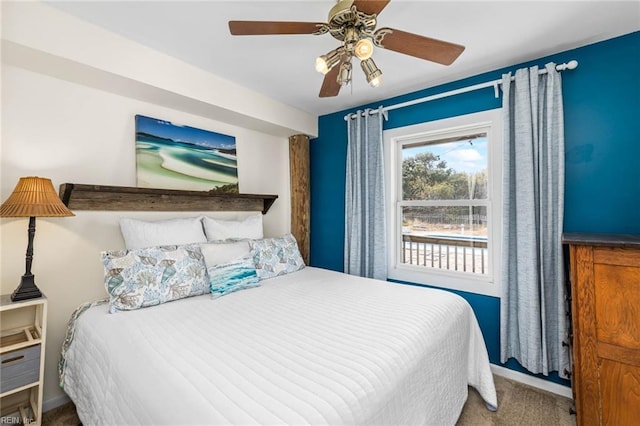 bedroom featuring ceiling fan and carpet