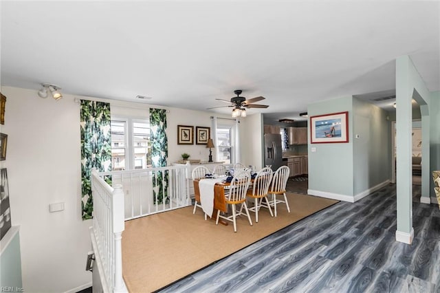 dining room with dark wood-type flooring and ceiling fan