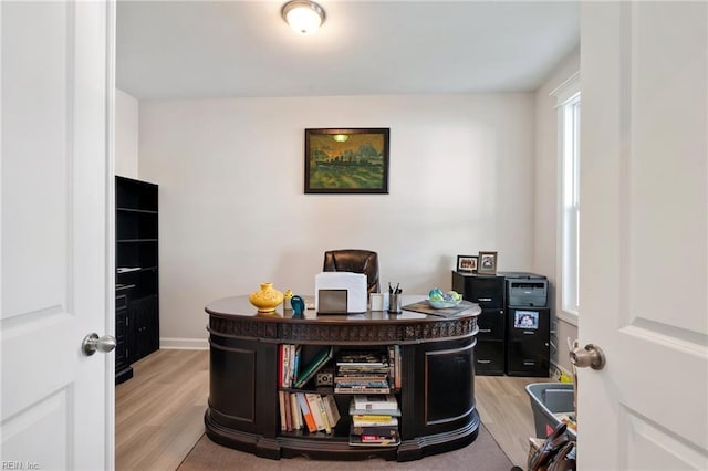 office area with light hardwood / wood-style flooring