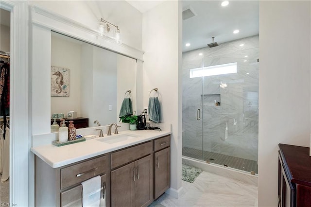 bathroom featuring an enclosed shower and vanity