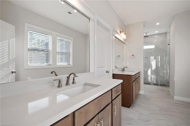 bathroom with an enclosed shower and vanity