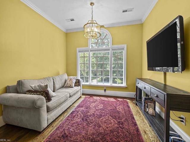 living room featuring a chandelier, crown molding, and dark hardwood / wood-style flooring