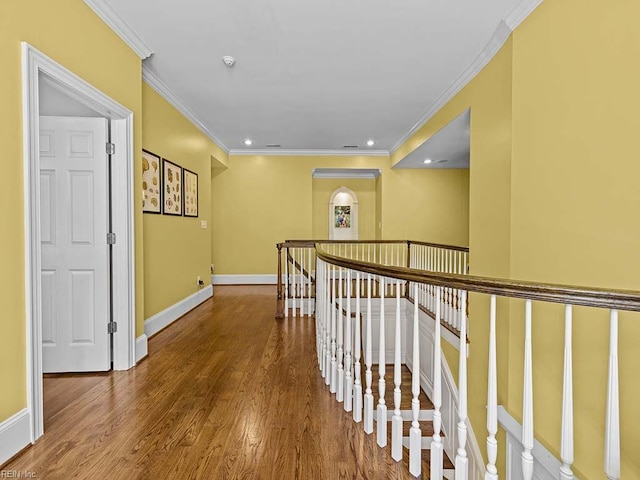 corridor featuring hardwood / wood-style floors and ornamental molding