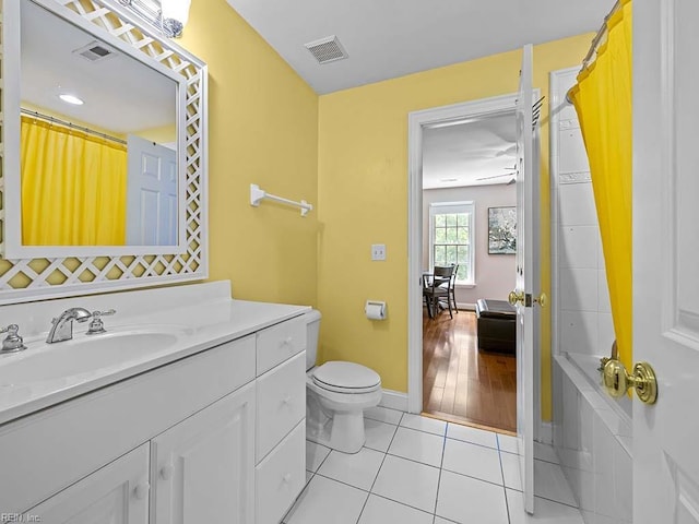 bathroom featuring toilet, tile patterned flooring, vanity, and a shower with shower curtain