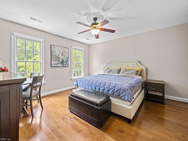 bedroom with hardwood / wood-style flooring and ceiling fan