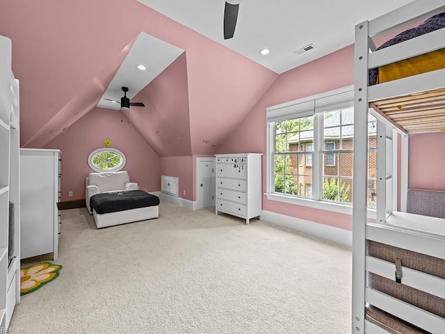 carpeted bedroom featuring ceiling fan and vaulted ceiling