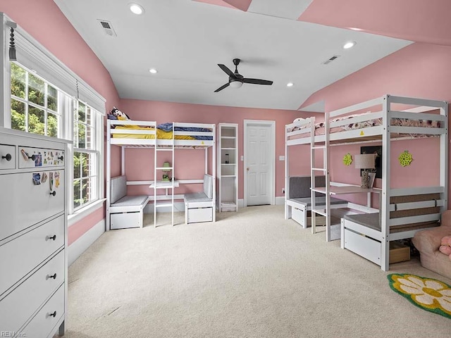 bedroom featuring ceiling fan, light carpet, and lofted ceiling