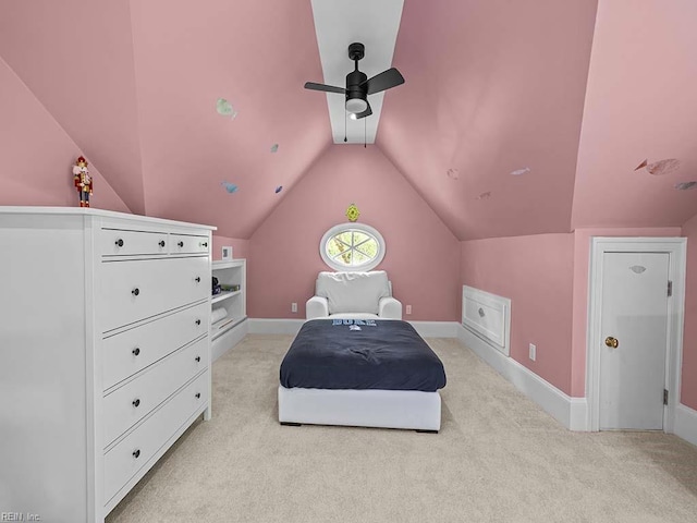 carpeted bedroom featuring ceiling fan and vaulted ceiling