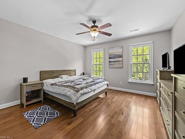 bedroom featuring hardwood / wood-style flooring and ceiling fan